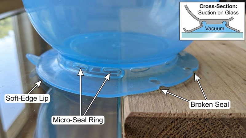 Nahaufnahme des Silikon-Saugfußmechanismus auf Glas- im Vergleich zu Holzoberflächen